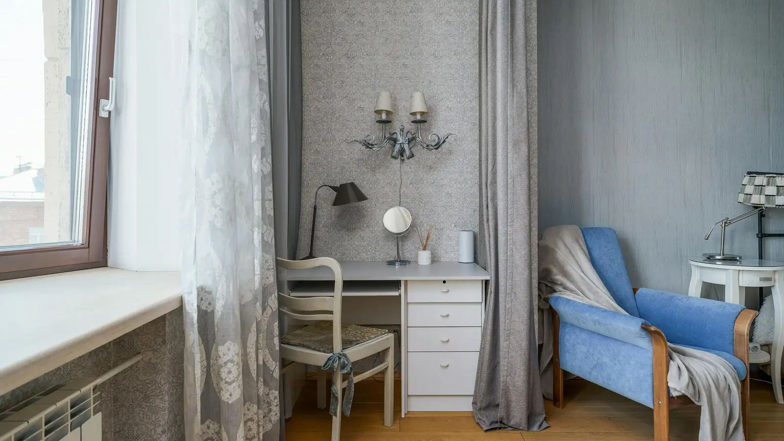 Elegant arched floor lamp next to an armchair